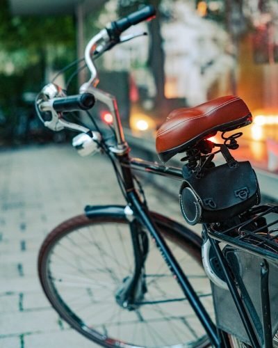 a bicycle parked on a sidewalk